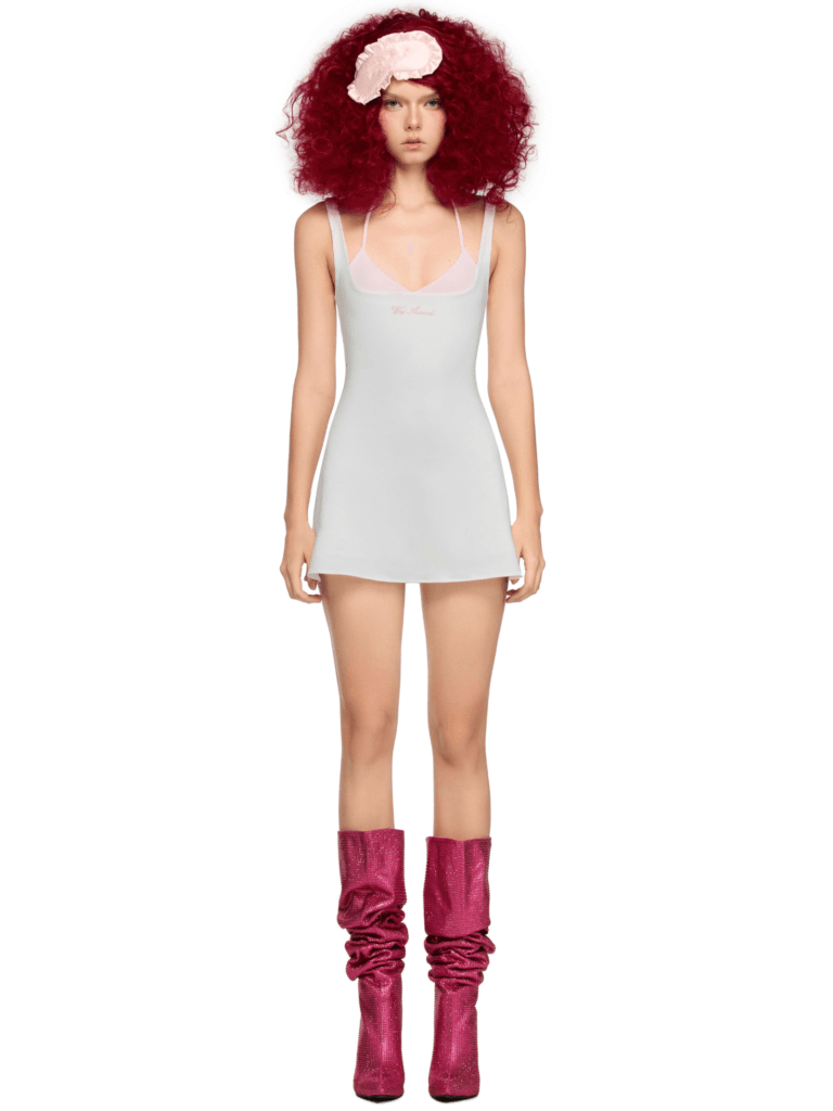 Model wearing Dynamy Baby pink halter mini party dress with boots