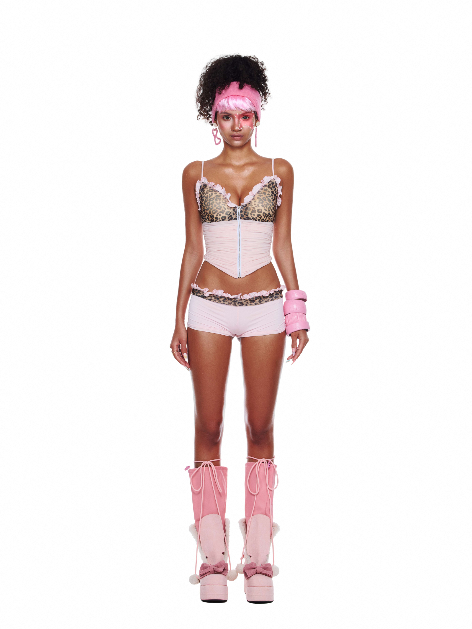 Two-piece pink beach outfit with mesh cami top and animal print bikini bottoms, styled for summer