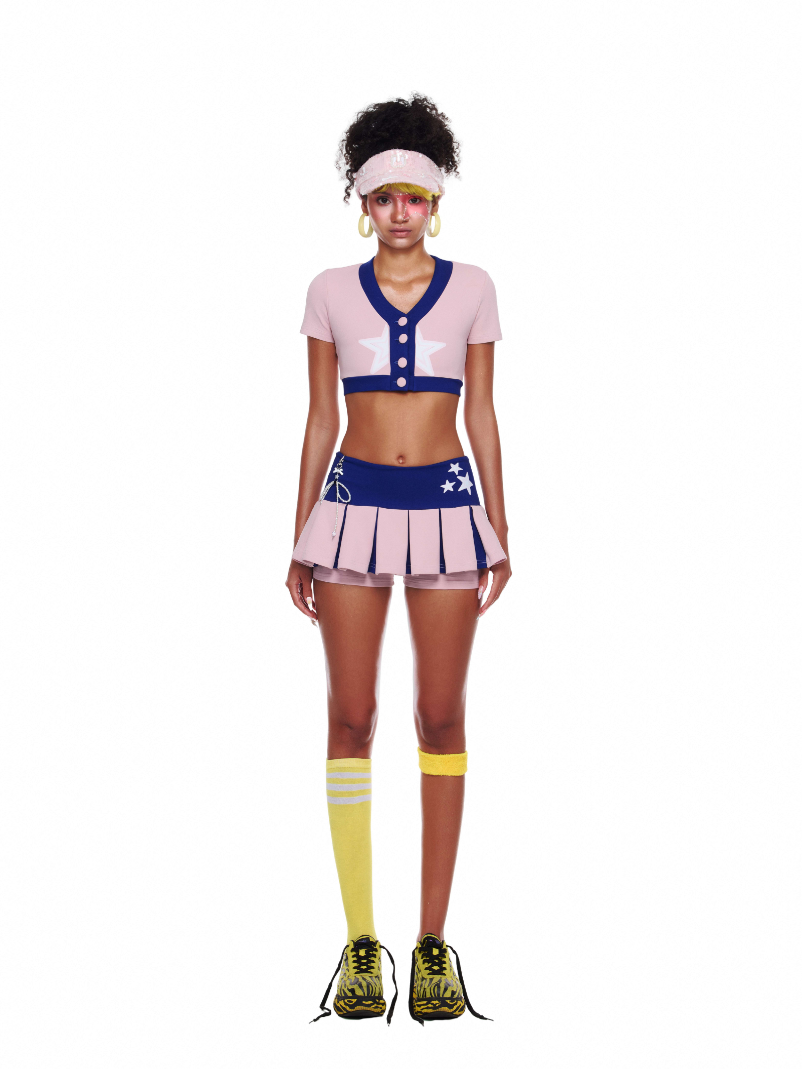 Front view of cheerleader outfit – pink and navy crop top with star patch